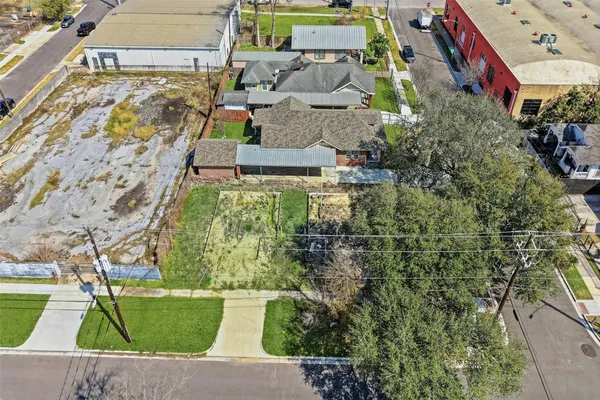 an aerial view of residential houses with outdoor space