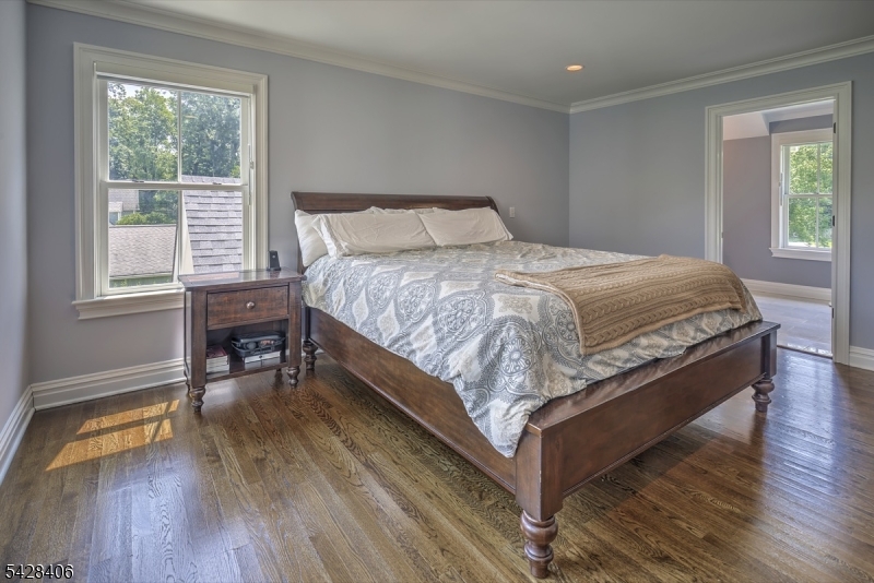 40 Sunnybrook Road Bernards, NJ 07920 - Photo 17 of 30 a bedroom with a bed and a table in it