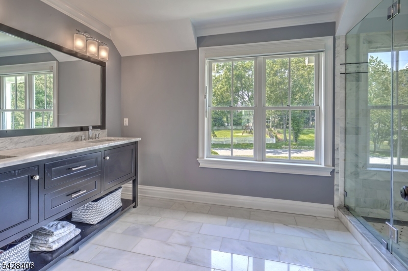 40 Sunnybrook Road Bernards, NJ 07920 - Photo 18 of 30 a bathroom with a sink double vanity and a mirror