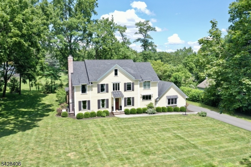 40 Sunnybrook Road Bernards, NJ 07920 - Photo 30 of 30 a view of white house with a big yard and large trees