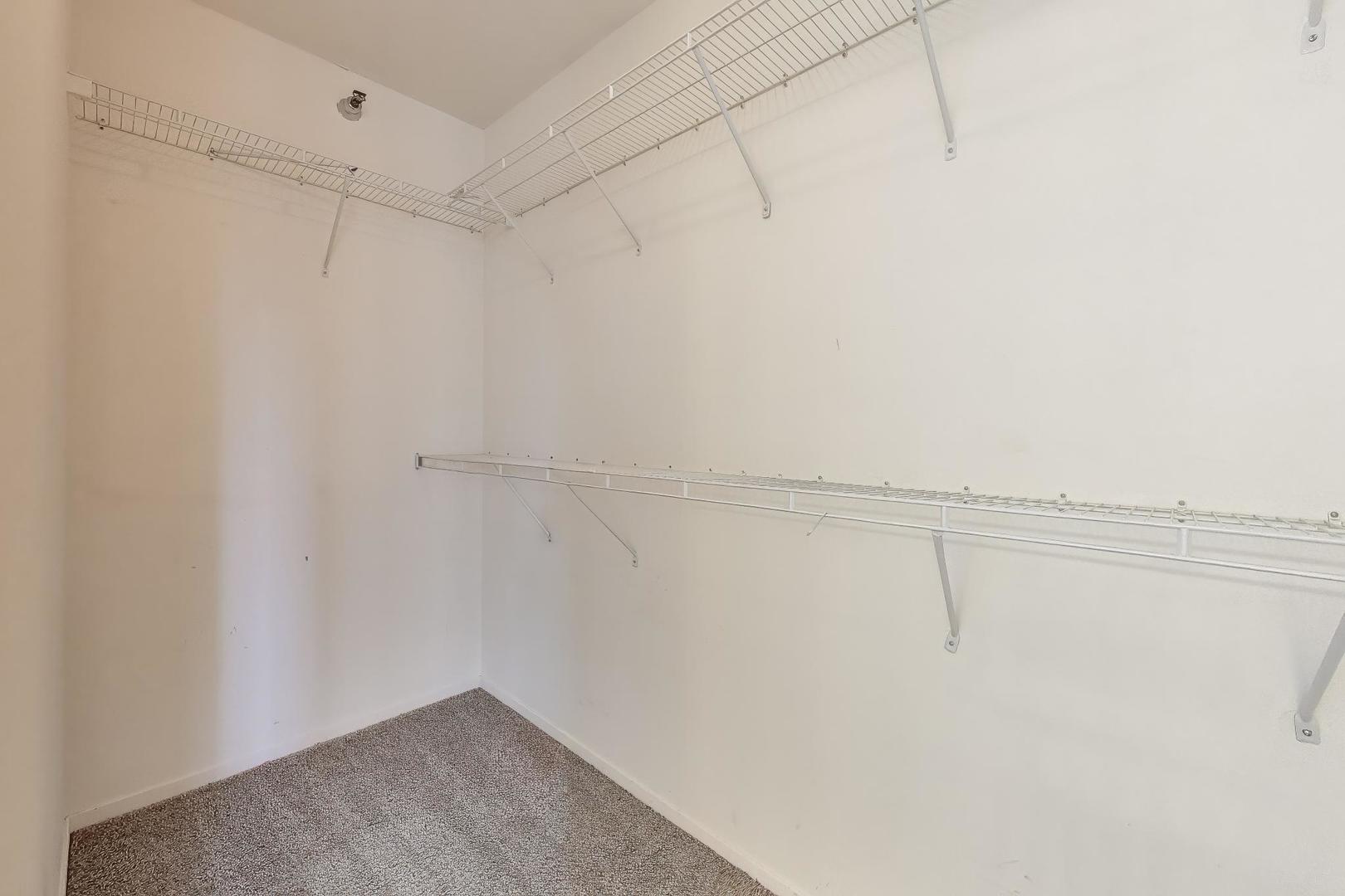 701 South Wells Street, Unit 1402 Chicago, IL 60607 - Photo 17 of 47 a view of a room with racks on the wall
