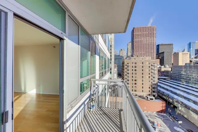 a view of a balcony with wooden floor