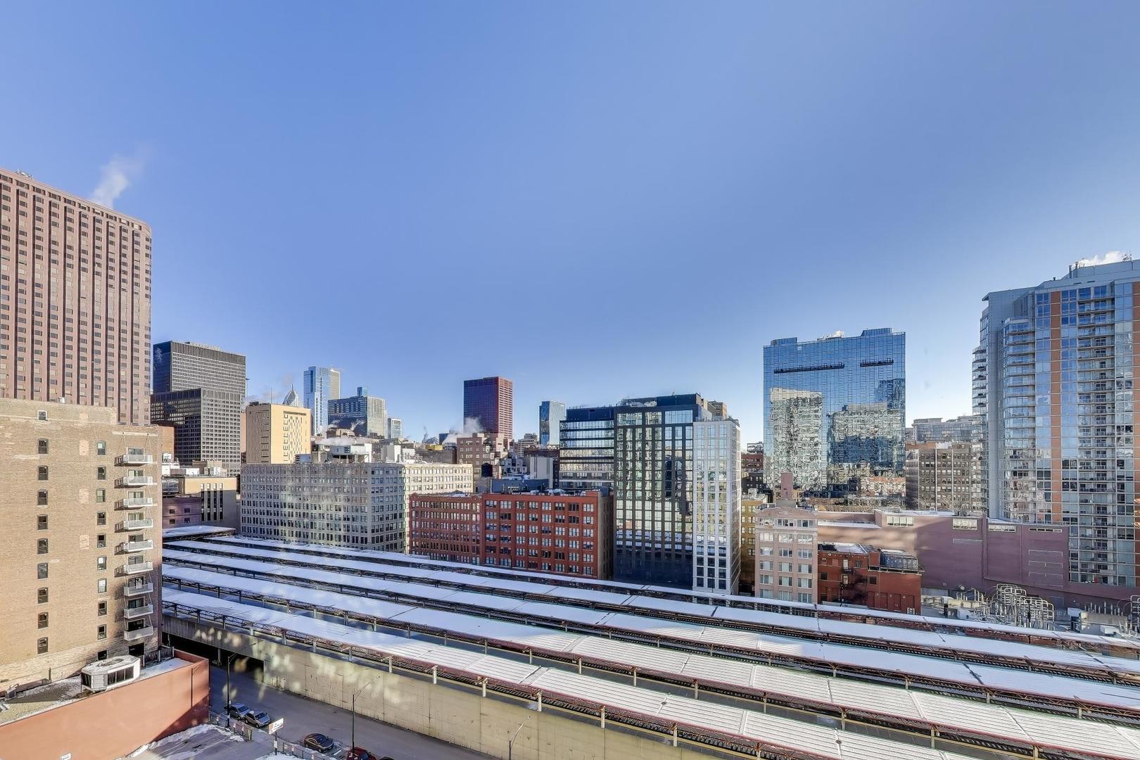 701 South Wells Street, Unit 1402 Chicago, IL 60607 - Photo 23 of 47 a view of a city with tall buildings