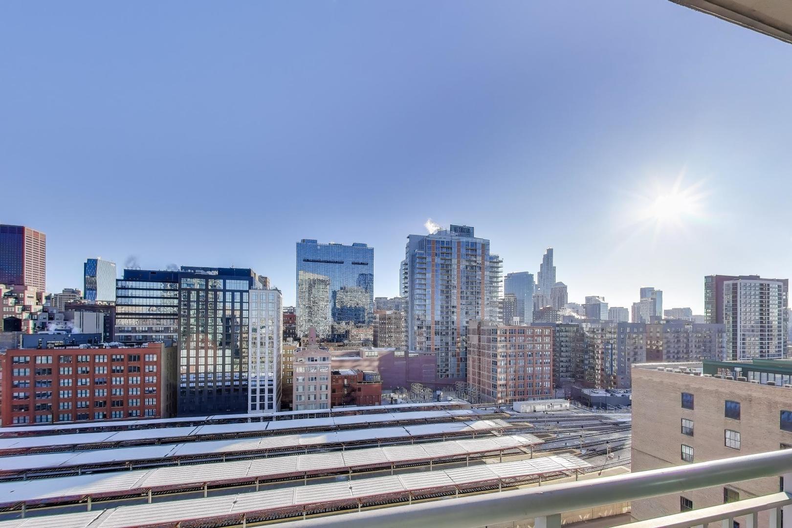 701 South Wells Street, Unit 1402 Chicago, IL 60607 - Photo 24 of 47 a view of a city with tall buildings
