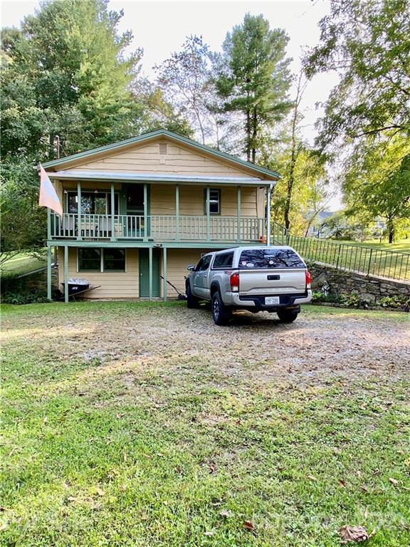 162 Upper Brush Creek Road Fletcher, NC 28732 - Photo 1 of 9 a house view with a garden space