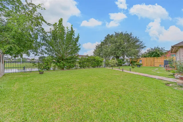 a view of a field of grass and trees