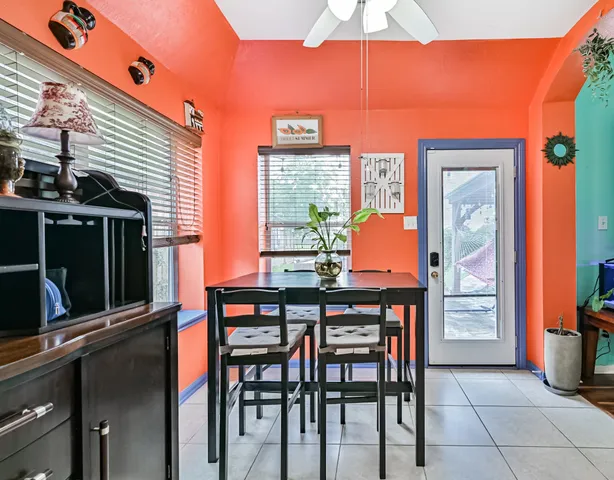 a table and chairs in front of a house