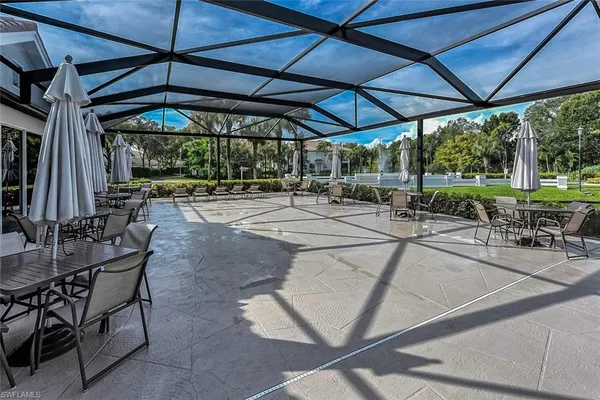 a view of a backyard with sitting area
