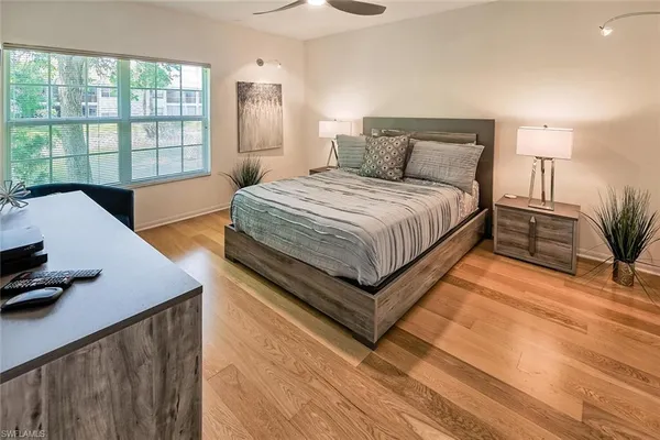 a bedroom with a bed and window