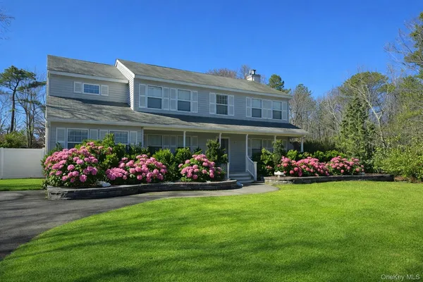 a view of a front of a house with a yard