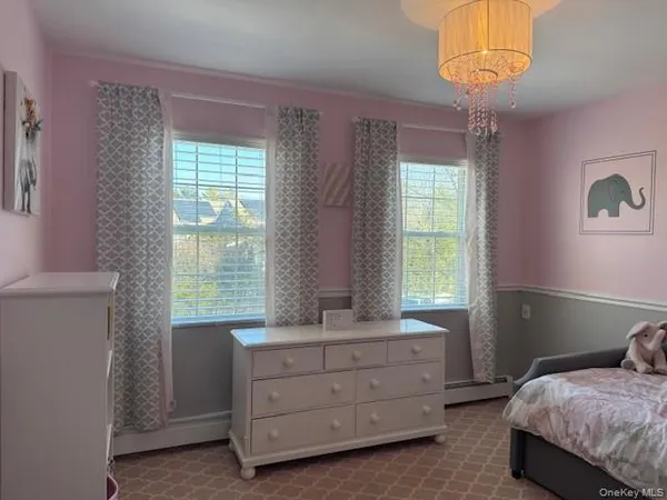 a room with a bed and a window