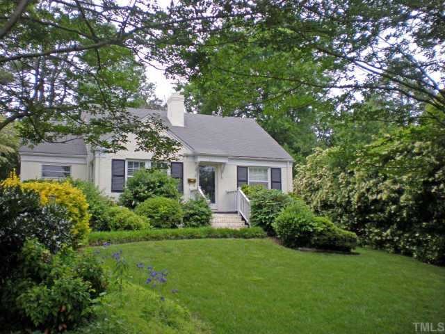 2711 Kittrell Drive Raleigh, NC 27608 - Photo 1 of 11 a front view of a house with a yard and trees