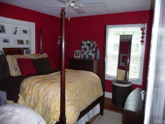 2711 Kittrell Drive Raleigh, NC 27608 - Photo 8 of 11 a bedroom with bed and window