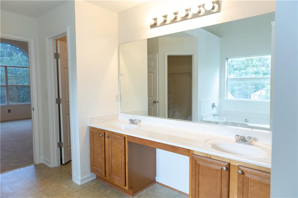 502 Streamside Place Canton, GA 30115 - Photo 19 of 33 a bathroom with a sink and a mirror