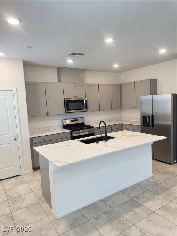 2444 Padulle Place Henderson, NV 89044 - Photo 2 of 11 Kitchen with fridge, light stone countertops, a si