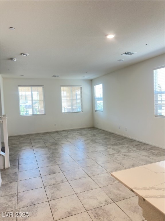 2444 Padulle Place Henderson, NV 89044 - Photo 3 of 11 Spare room featuring light tile patterned floors,