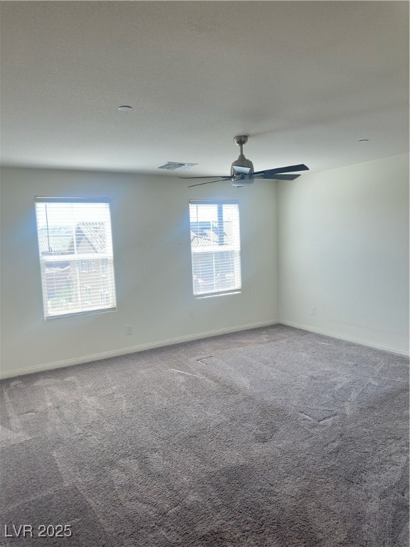 2444 Padulle Place Henderson, NV 89044 - Photo 4 of 11 Carpeted empty room featuring baseboards, ceiling