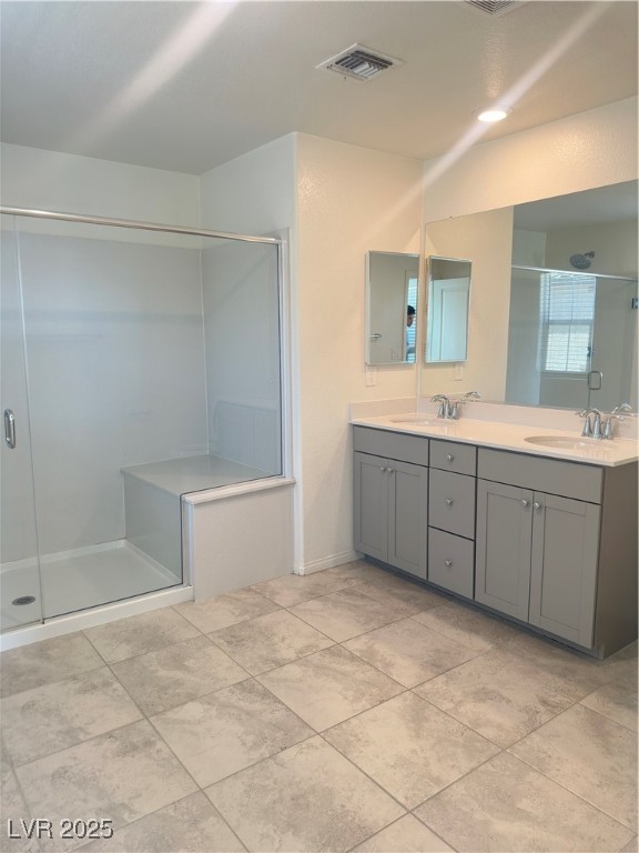 2444 Padulle Place Henderson, NV 89044 - Photo 5 of 11 Bathroom with double vanity, visible vents, a sink