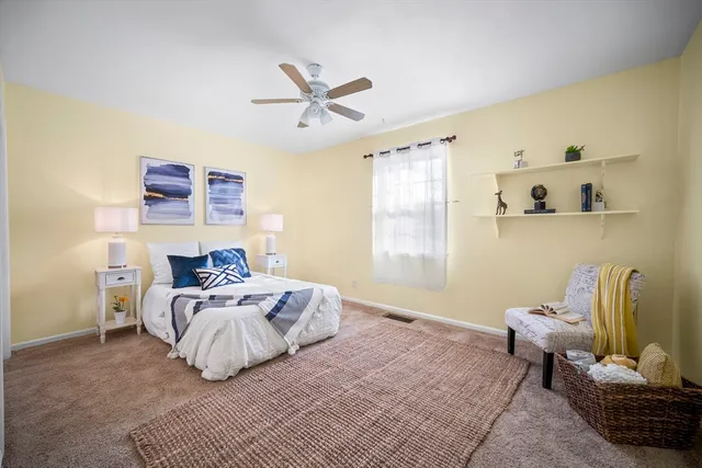 a bedroom with a bed and window