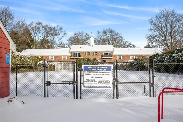 a car parked in front of a white house
