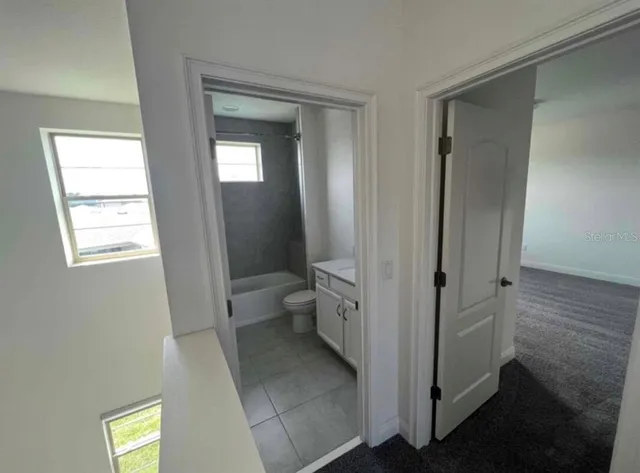 a bathroom with a sink and toilet