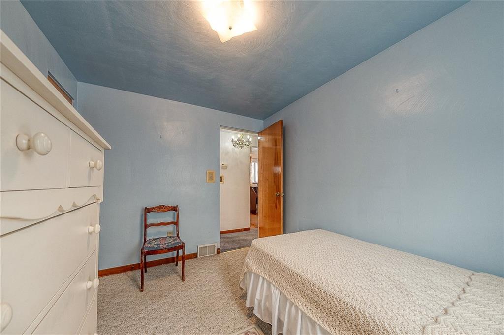 21 Spring Street Etna, PA 15223 - Photo 16 of 27 a bedroom with a bed and a window