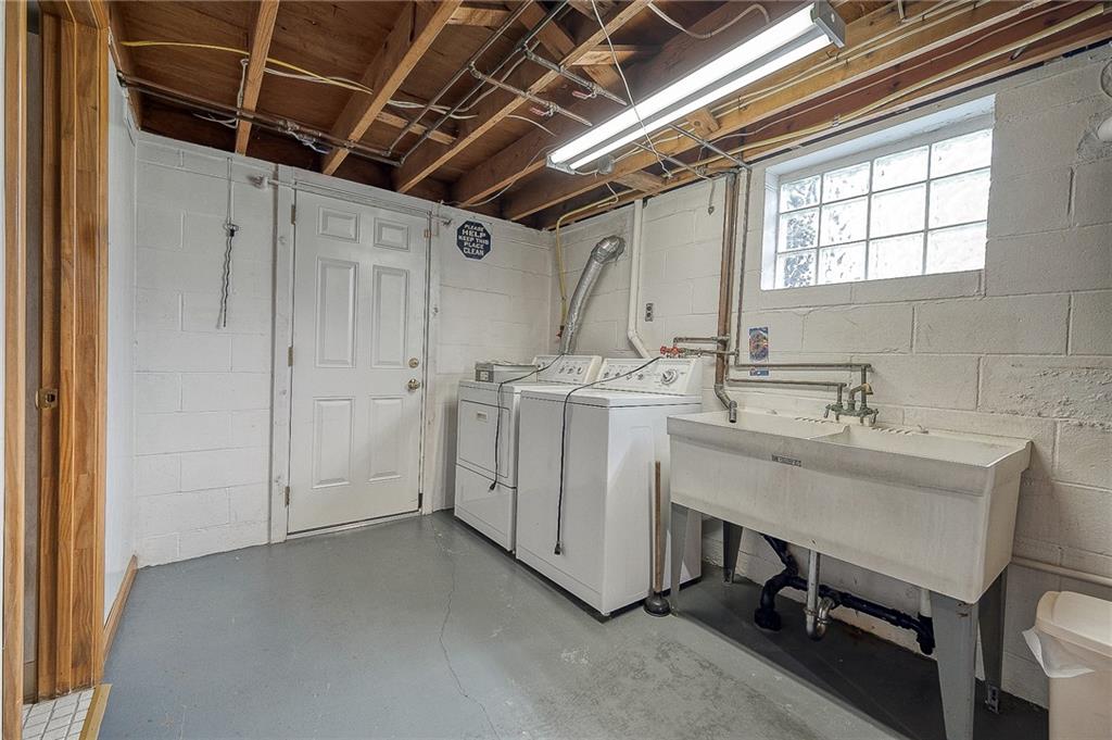 21 Spring Street Etna, PA 15223 - Photo 17 of 27 a utility room with cabinets washer and dryer