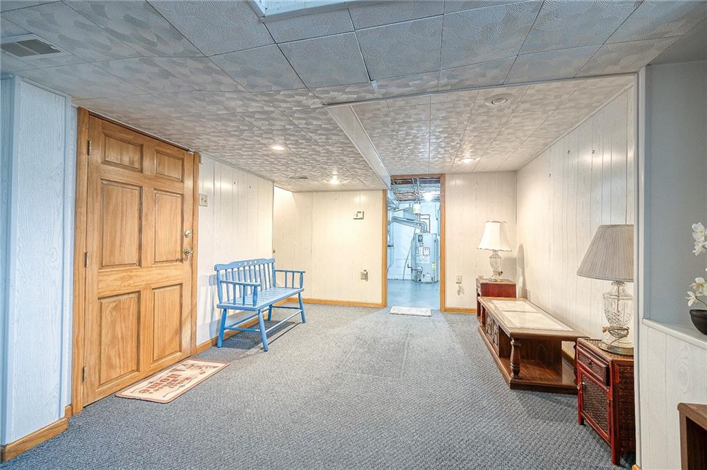 21 Spring Street Etna, PA 15223 - Photo 22 of 27 a spacious bedroom with a bed and furniture