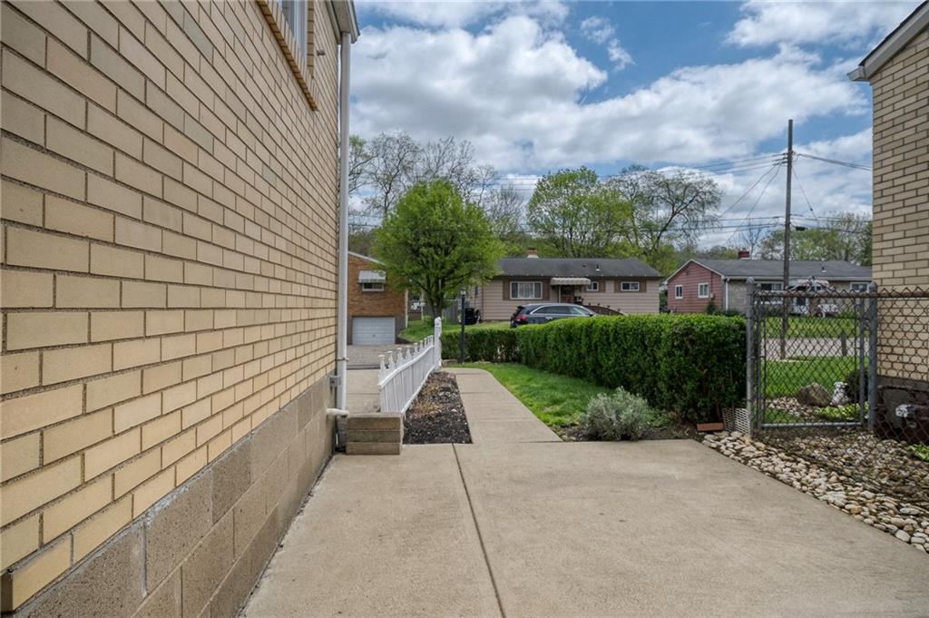 21 Spring Street Etna, PA 15223 - Photo 23 of 27 a view of a pathway both side of house