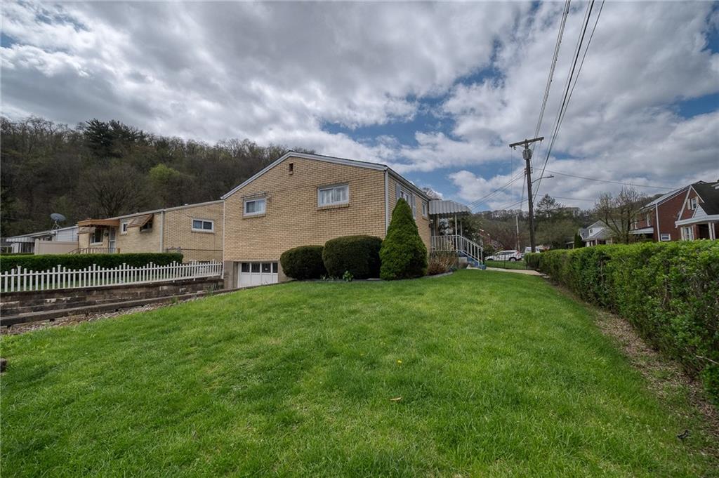 21 Spring Street Etna, PA 15223 - Photo 26 of 27 a front view of a house with a garden
