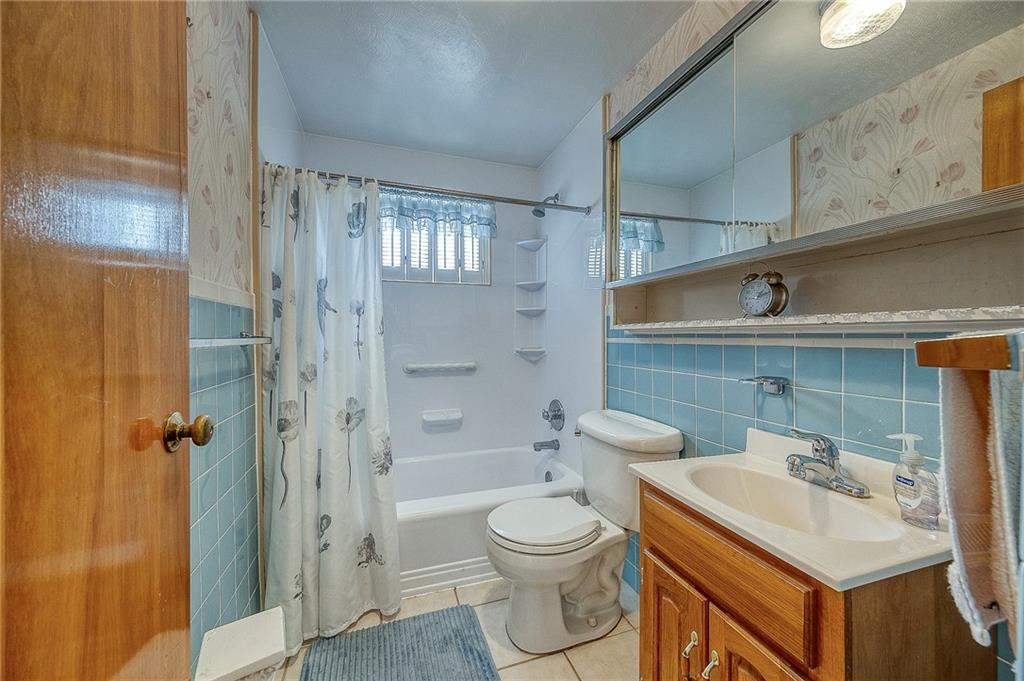 21 Spring Street Etna, PA 15223 - Photo 10 of 27 a bathroom with a sink toilet and shower