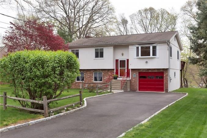 12 Neighborly Way Greenwich, CT 06878 - Photo 1 of 1 a view of a house with a yard and sitting area