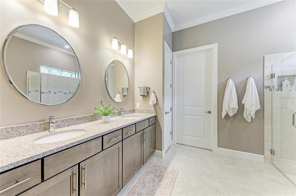 17631 Colebrook Circle Lakewood Ranch, FL 34202 - Photo 40 of 85 a bathroom with a double vanity sink and a mirror