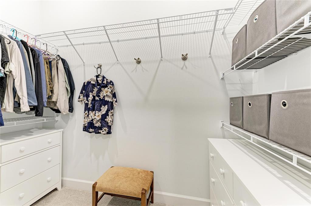 17631 Colebrook Circle Lakewood Ranch, FL 34202 - Photo 42 of 85 a view of walk in closet with clothes