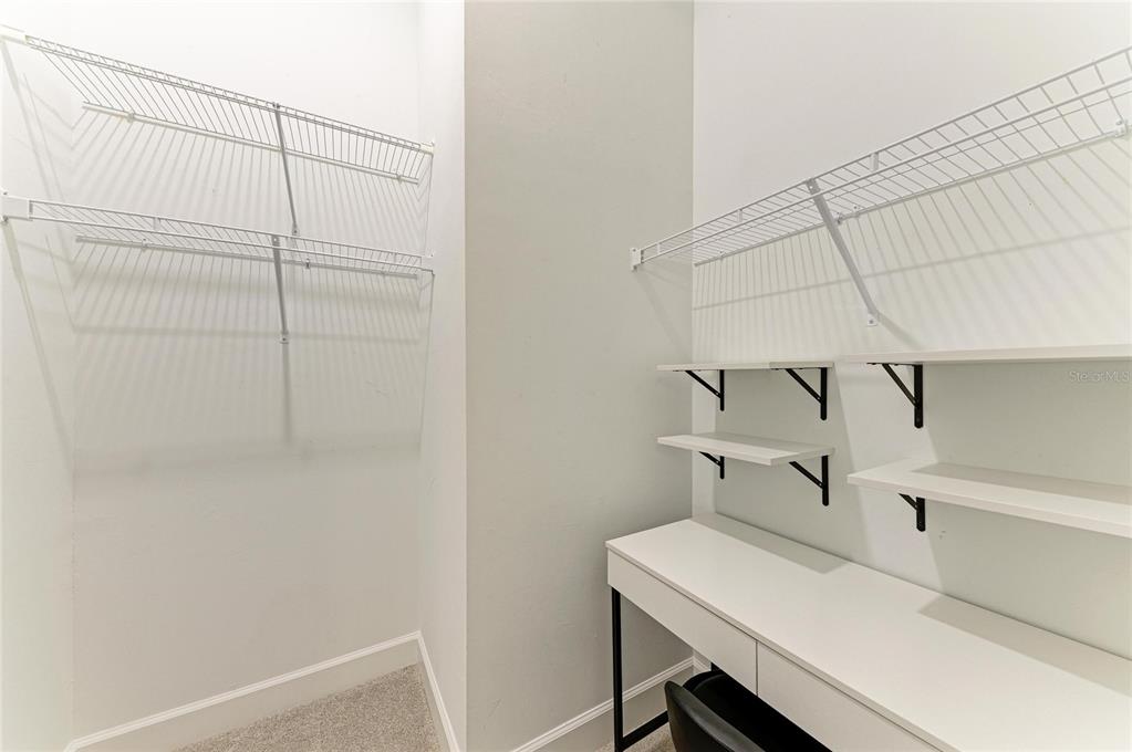 17631 Colebrook Circle Lakewood Ranch, FL 34202 - Photo 47 of 85 a view of storage and utility room with racks on the wall