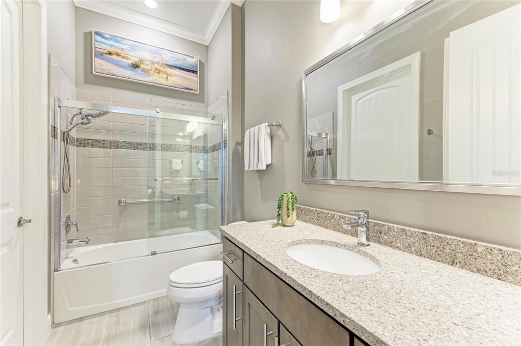 17631 Colebrook Circle Lakewood Ranch, FL 34202 - Photo 48 of 85 a bathroom with a granite countertop sink toilet and shower
