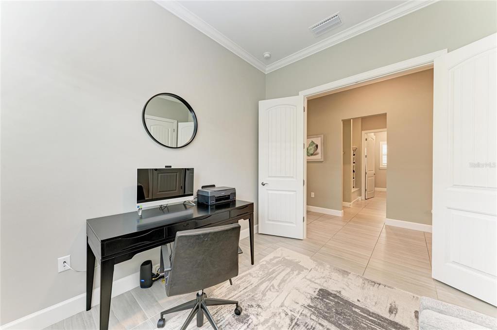 17631 Colebrook Circle Lakewood Ranch, FL 34202 - Photo 53 of 85 a view of a workspace with furniture and wooden floor