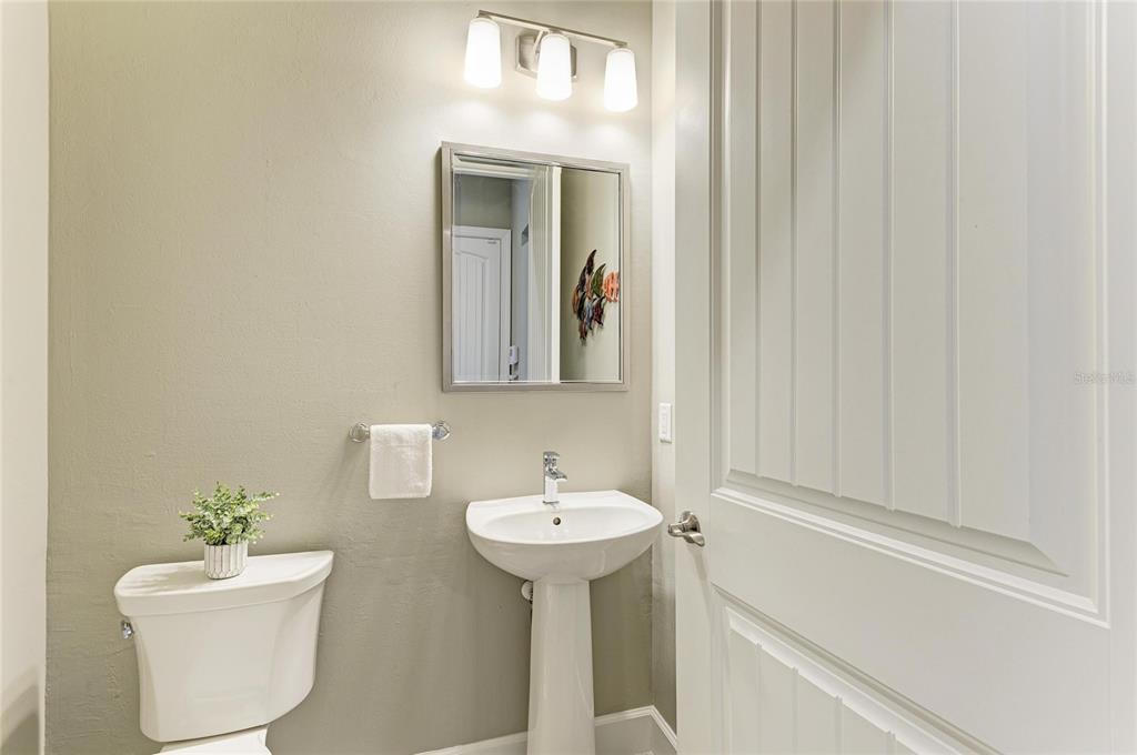 17631 Colebrook Circle Lakewood Ranch, FL 34202 - Photo 54 of 85 a bathroom with a toilet a sink and a mirror