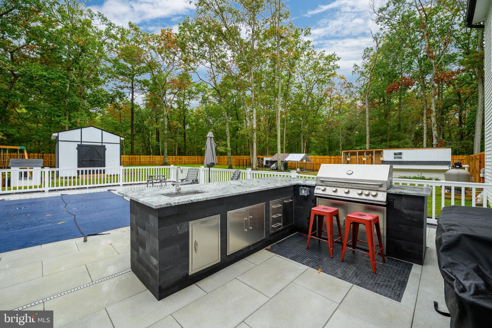 453 Stage Road Little Egg Harbor, NJ 08087 - Photo 8 of 54 Outdoor kitchen oasis with lush greenery.