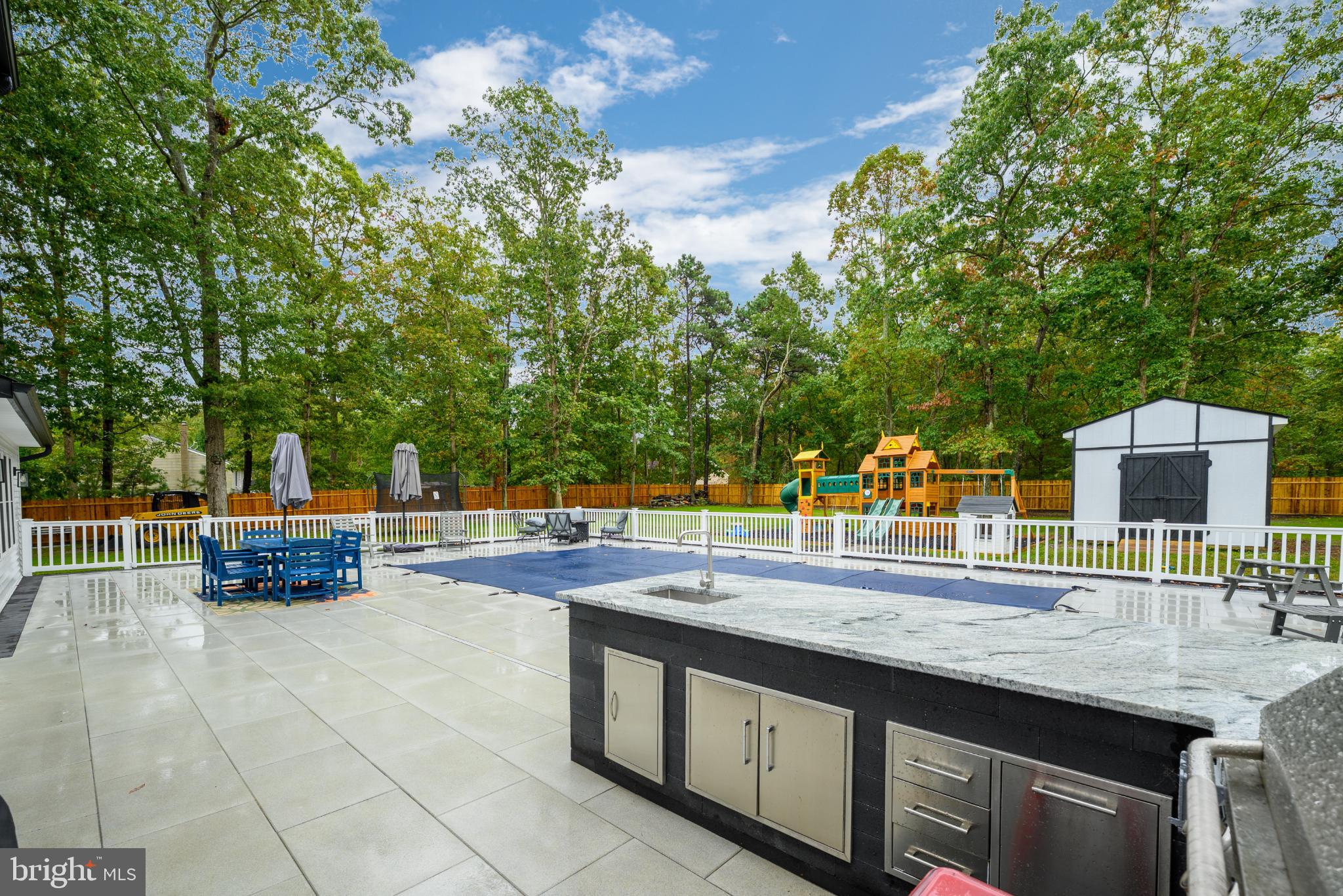 453 Stage Road Little Egg Harbor, NJ 08087 - Photo 9 of 54 Serene backyard oasis with pool and greenery.