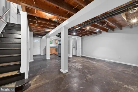 a view of an empty room with white walls