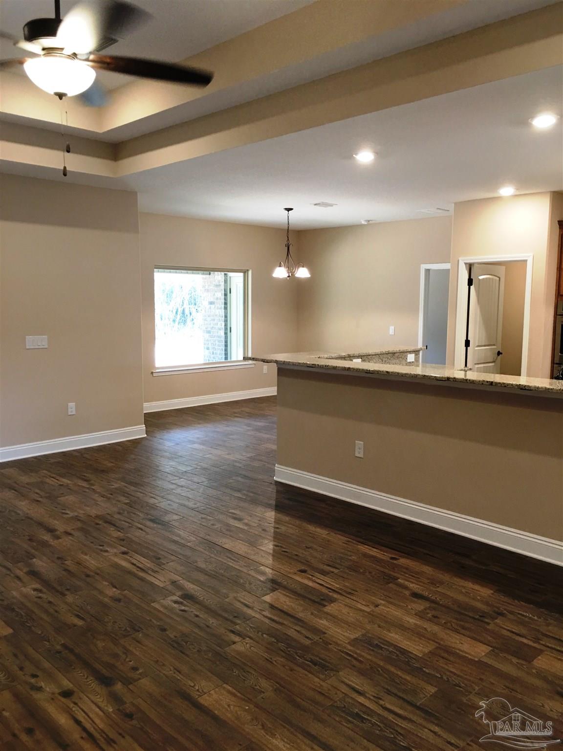 5480 South A Jones Road Milton, FL 32583 - Photo 11 of 35 Living room has double box ceiling w/fan/light.
