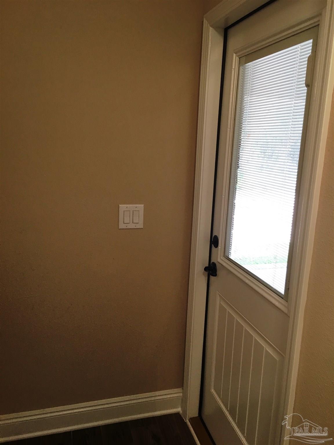 5480 South A Jones Road Milton, FL 32583 - Photo 21 of 35 Rear hall patio door leads to the covered patio.