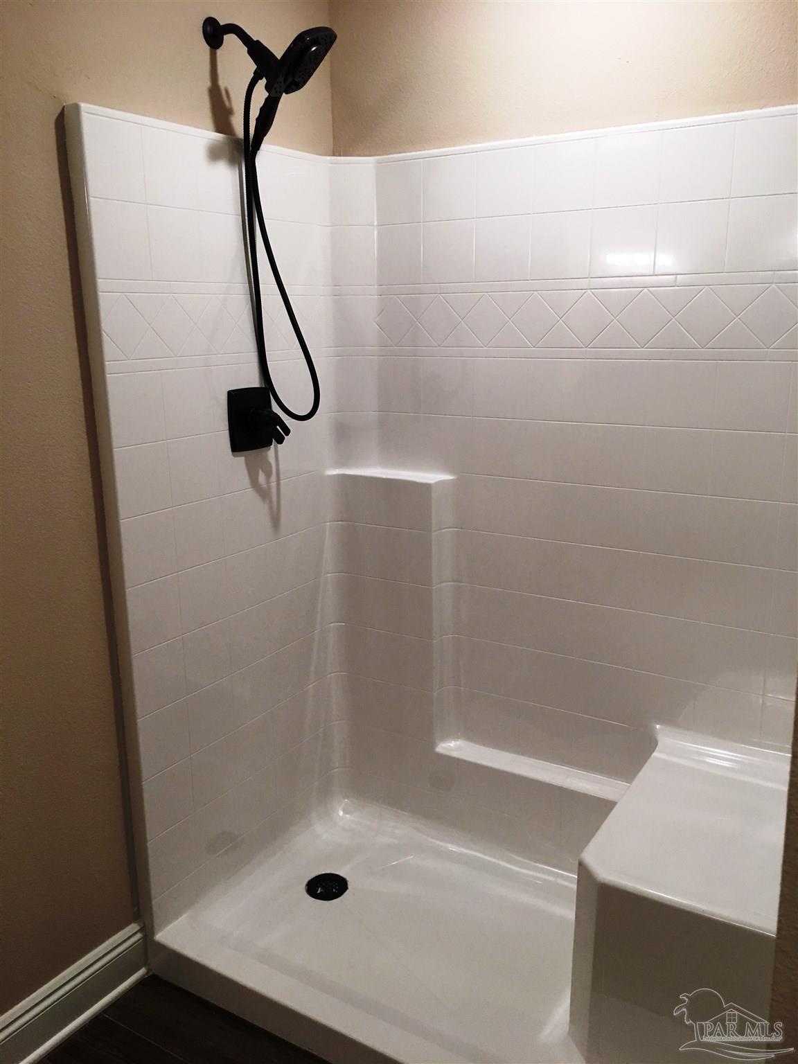 5480 South A Jones Road Milton, FL 32583 - Photo 29 of 35 Master bath has a fiberglass shower w/seat.
