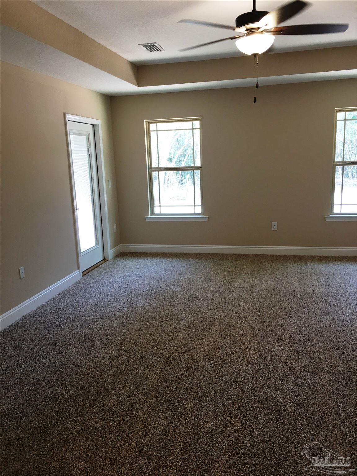 5480 South A Jones Road Milton, FL 32583 - Photo 32 of 35 Master bedroom has private exit/entry to patio.