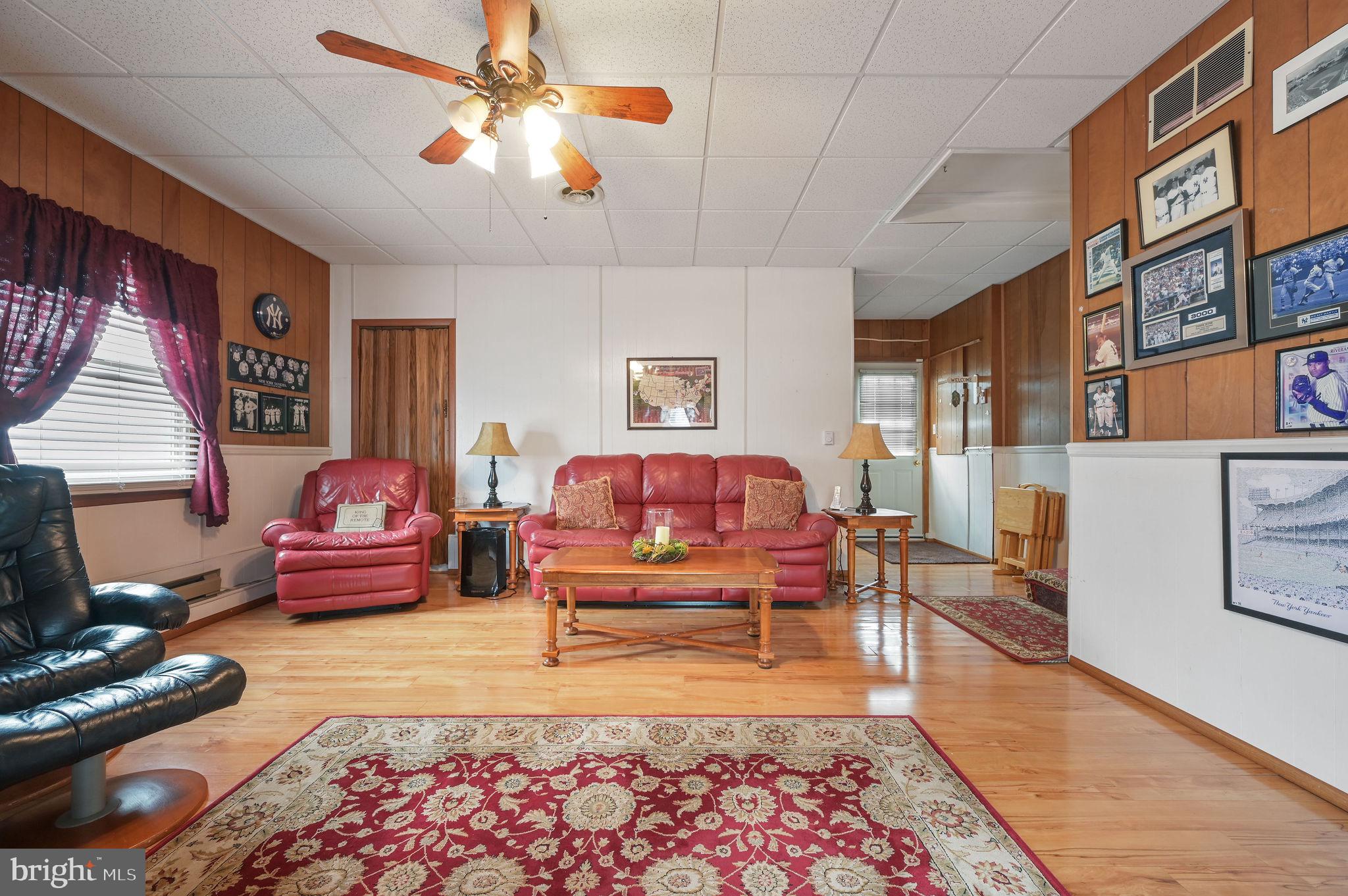 4634 Kenton Road Dover, DE 19904 - Photo 21 of 34 a living room with furniture and a rug