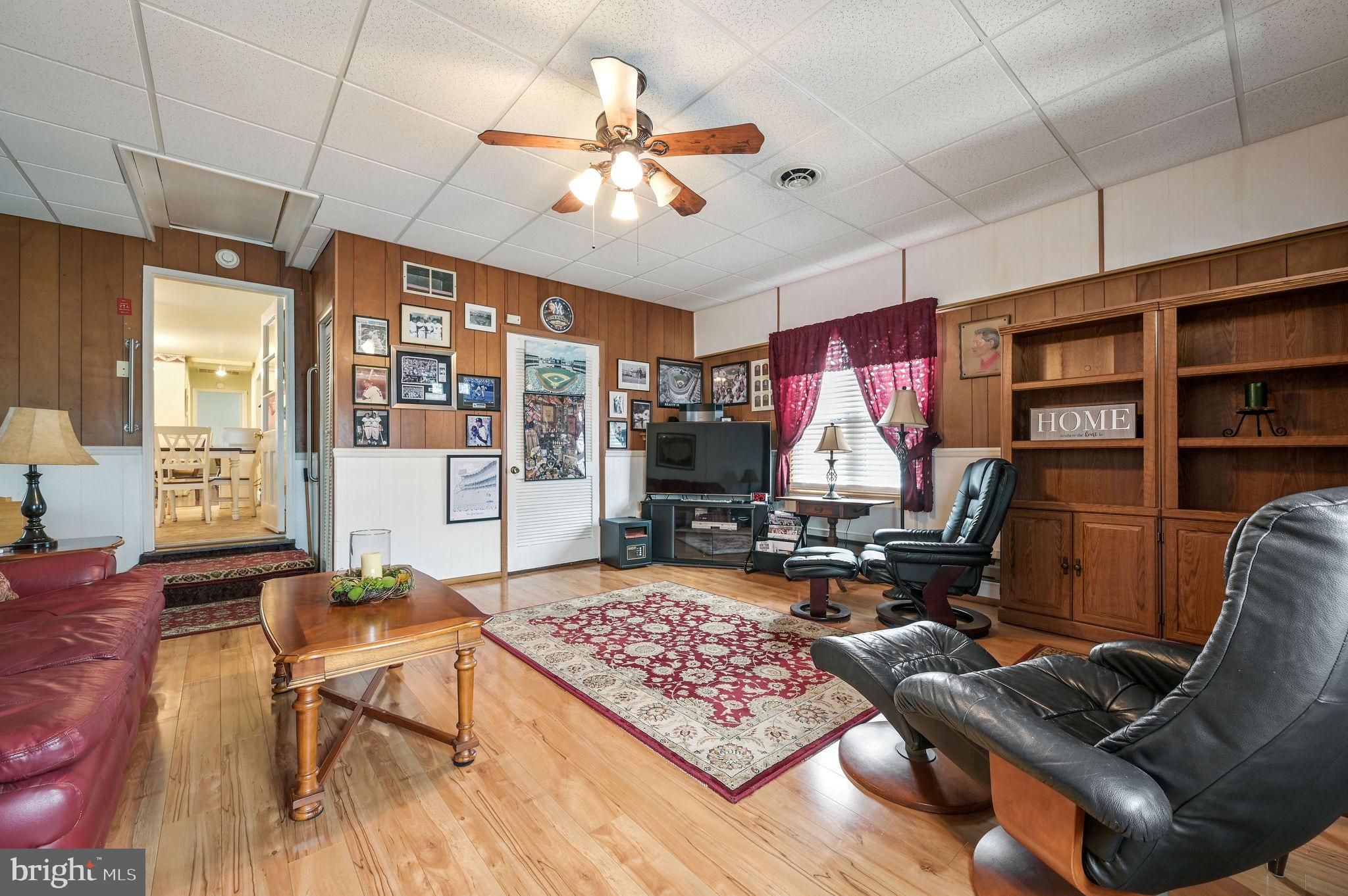 4634 Kenton Road Dover, DE 19904 - Photo 23 of 34 a living room with furniture gym equipment and a rug