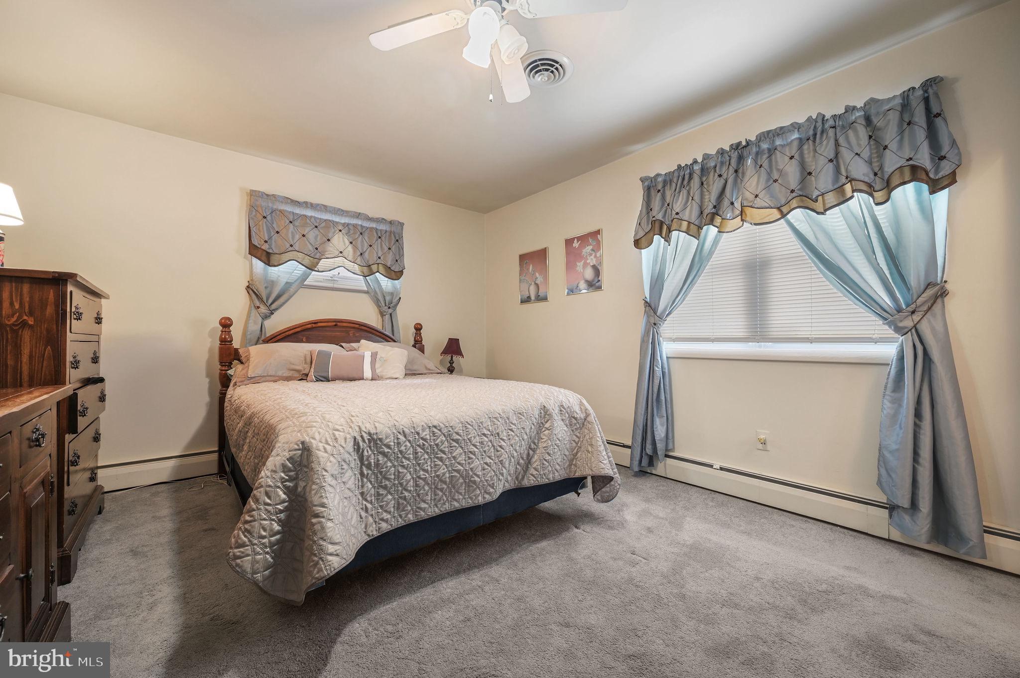 4634 Kenton Road Dover, DE 19904 - Photo 25 of 34 a bedroom with a bed and a window