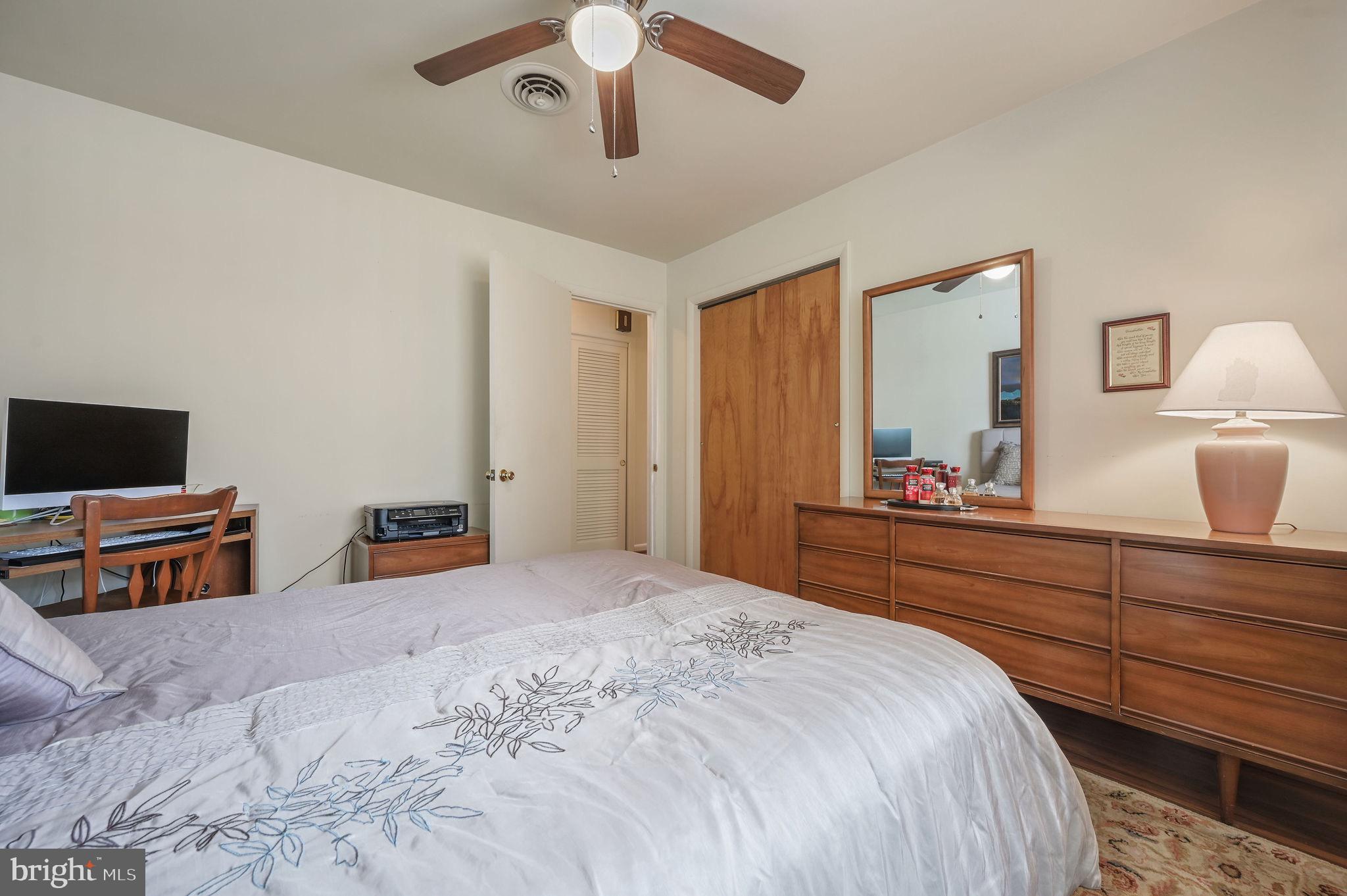 4634 Kenton Road Dover, DE 19904 - Photo 27 of 34 a bedroom with a bed and a flat screen tv