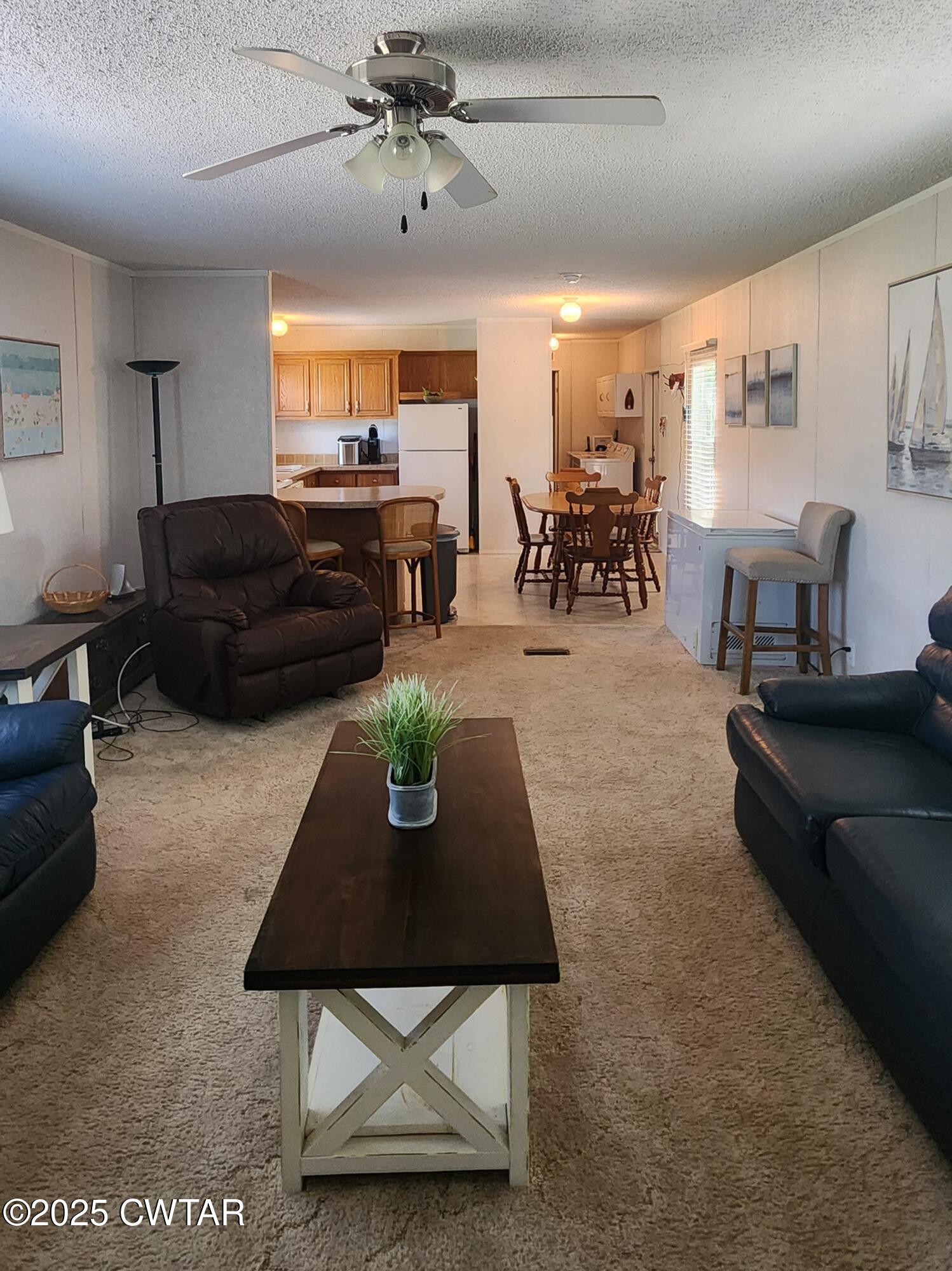 407 Pevahouse Camp Lane Decaturville, TN 38329 - Photo 11 of 44 living room to kitchen